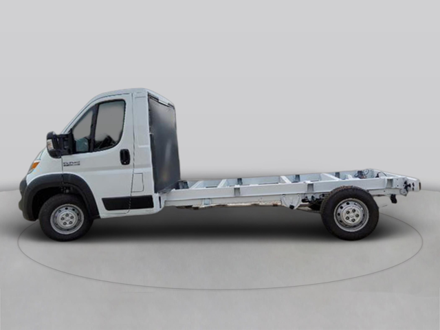 Side profile of a white chassis cab truck displaying the cab and long exposed frame