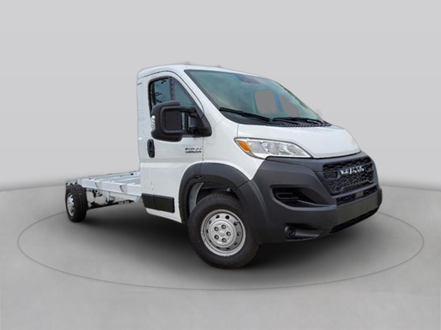 White chassis cab truck in front three-quarter view from opposite side