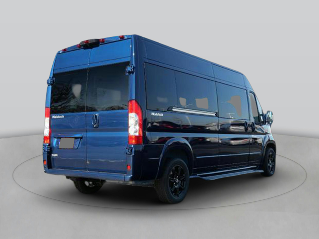 Rear three-quarter view of a dark blue van with side panels