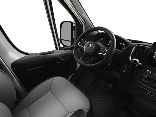 Interior driver-side view of a van showing steering wheel