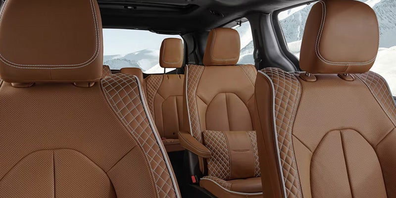Interior of a minivan showing brown leather seats