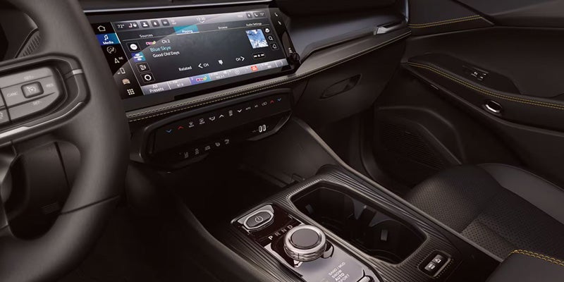 Vehicle dashboard and center console with touchscreen display, rotary gear selector