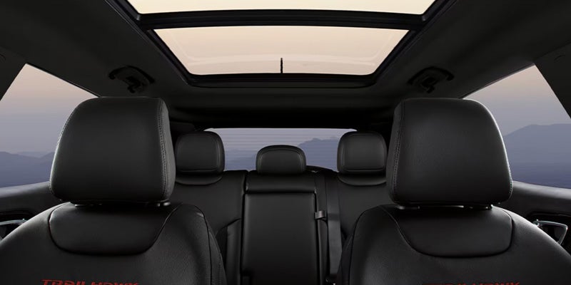 Interior view showing rear seats and a large panoramic sunroof