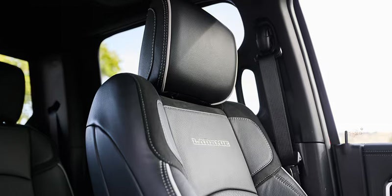 Close-up of a black leather front seat inside a RAM truck