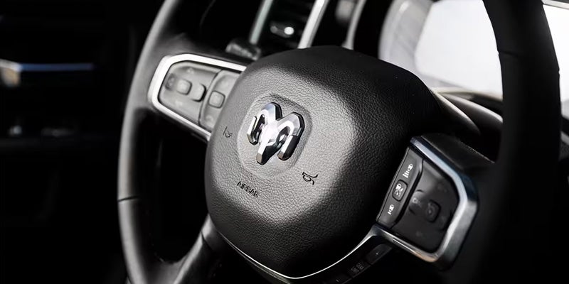 Close-up of a RAM steering wheel with built-in control buttons