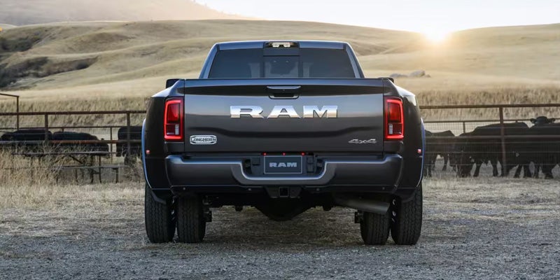 Rear view of a RAM truck parked outdoors with tailgate closed
