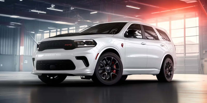 A white Dodge Durango SUV is displayed, showcasing its sleek design and modern features.